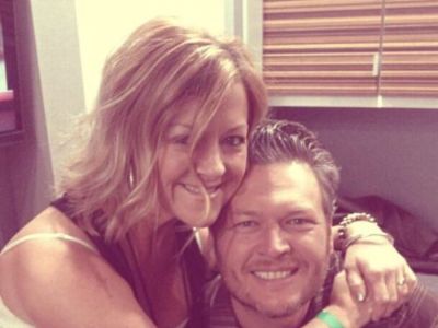 Endy Shelton is hugging Blake Shelton in the picture.